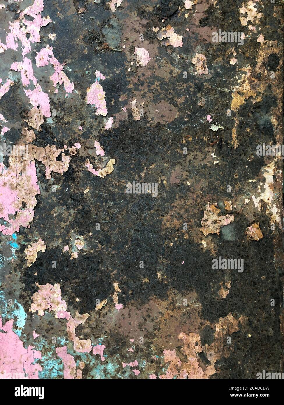 Rusty background A rusty old metal plate with cracked white gloss paint Stock Photo