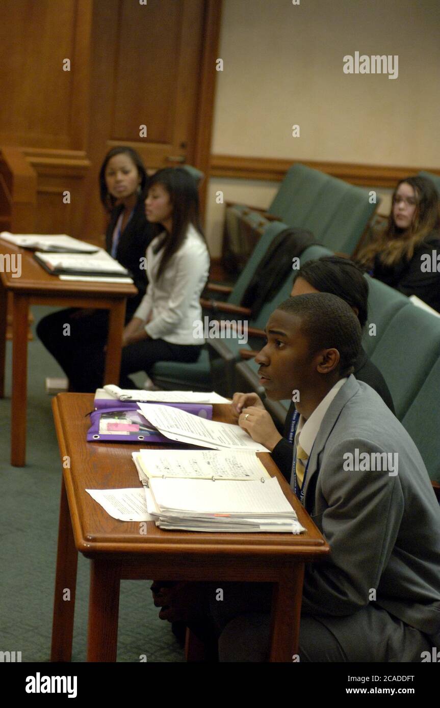 Austin Texas USA, 2006: Teens serve as prosecuting and defense attorneys as Texas high school students participate in mock court hearings as part of YMCA Youth in Government program at the state Supreme Court courtroom. Students learn more about the legal profession by acting out trials in competition with their peers.  ©Bob Daemmrich Stock Photo