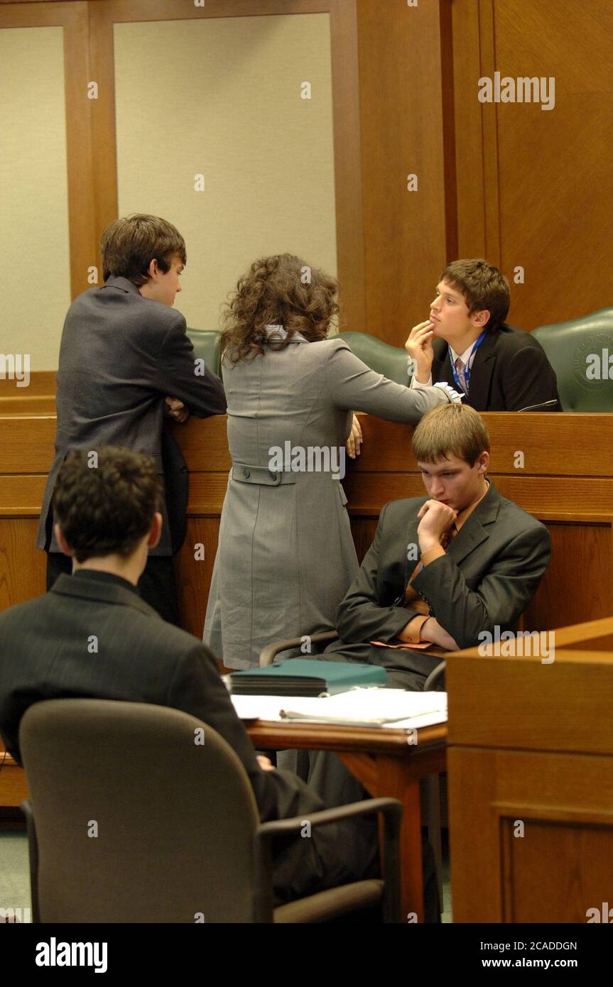 Austin Texas USA, 2006: A teen judge sits on the bench as Texas high school students participate in mock court hearings as part of YMCA Youth in Government program at the state Supreme Court courtroom. Students learn more about the legal profession by acting out trials in competition with their peers.  ©Bob Daemmrich Stock Photo