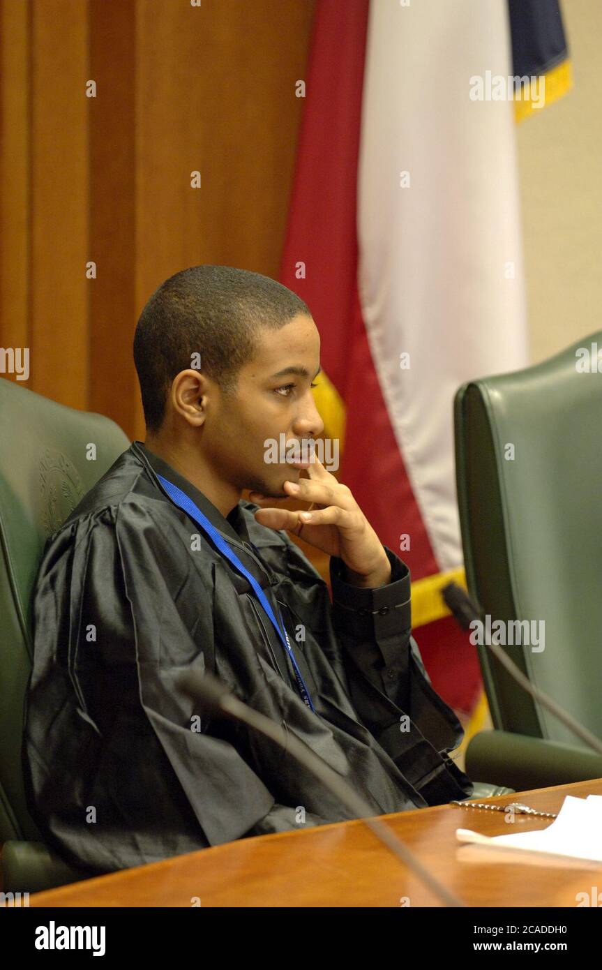 Austin Texas USA, 2006: A teen judge sits on the bench as Texas high school students participate in mock court hearings as part of YMCA Youth in Government program at the state Supreme Court courtroom. Students learn more about the legal profession by acting out trials in competition with their peers.  ©Bob Daemmrich Stock Photo