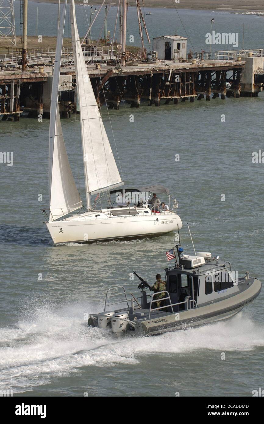 Port Aransas, Texas USA, January 15, 2006:  A harbor police boat works the Aransas Channel into Corpus Christi Bay on the Texas Gulf coast  ©Bob Daemmrich Stock Photo