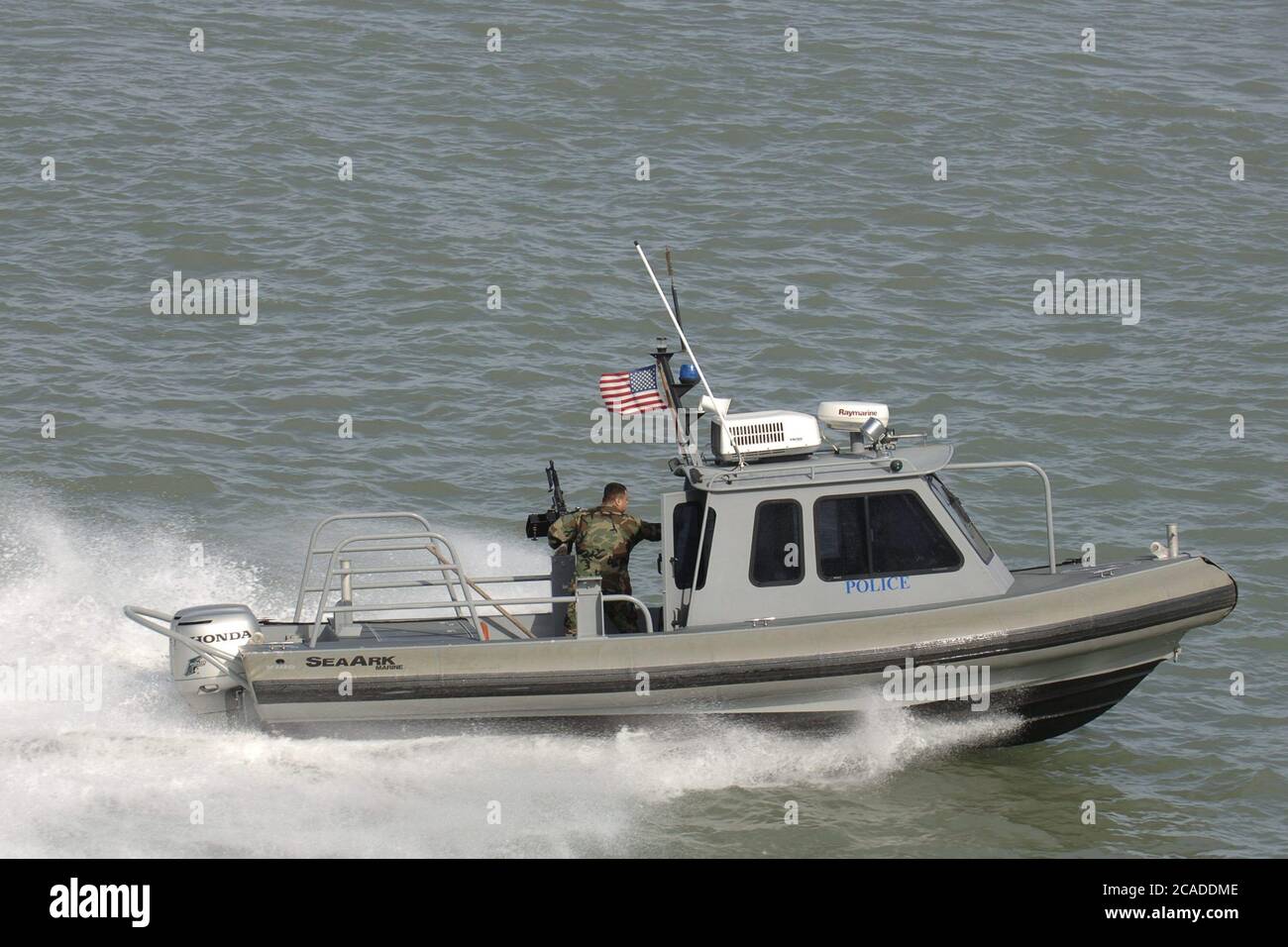 Port Aransas, Texas USA, January 15, 2006:  A harbor police boat works the Aransas Channel into Corpus Christi Bay on the Texas Gulf coast  ©Bob Daemmrich Stock Photo