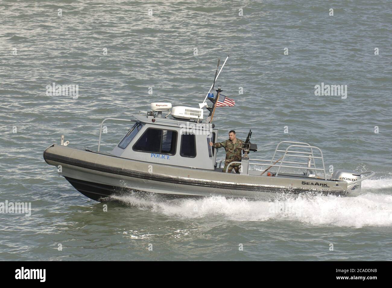 Port Aransas, Texas USA, January 15, 2006:  A harbor police boat works the Aransas Channel into Corpus Christi Bay on the Texas Gulf coast  ©Bob Daemmrich Stock Photo