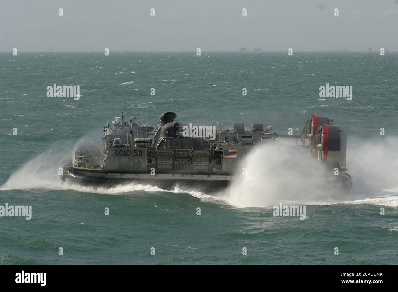 Port Aransas, TX January 15, 2006: During the maiden voyage of the USS San Antonio (LPD-17) amphibious transport dock after her commissioning ceremony, a Landing Craft Air Cushion (LCAC) capable of carrying 100 troops into battle, is demonstrated in the Gulf of Mexico. ©Bob Daemmrich Stock Photo
