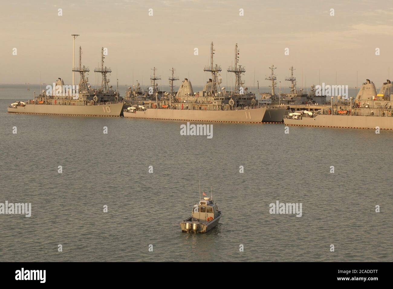 Ingleside, Texas USA, January 15, 2006:  A police boat monitors activity at the Ingleside Navy pier where a fleet of minesweepers are docked. ©Bob Daemmrich Stock Photo