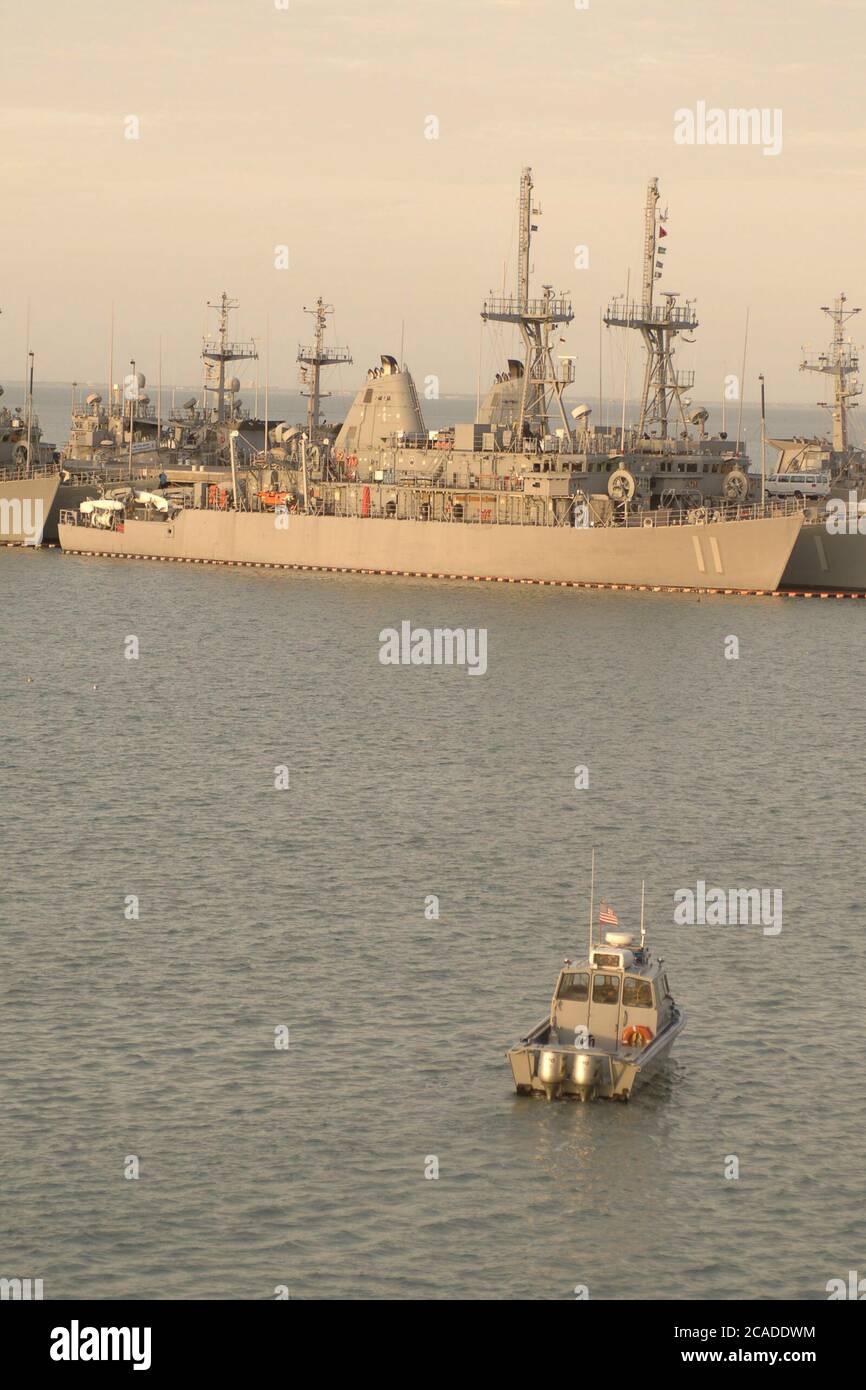 Ingleside, Texas USA, January 15, 2006:  A police boat monitors activity at the Ingleside Navy pier where a fleet of minesweepers are docked. ©Bob Daemmrich Stock Photo