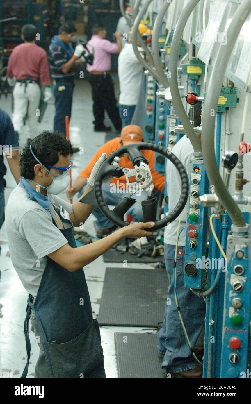 Matamoros, Mexico April, 2006: Steering wheel manufacturing at Delphi Delco Electronics de Mexico, a maquiladora plant across the United States border from Brownsville Texas that makes parts for General Motors cars. Delphi has about 11,000 Mexican workers in seven factories near Matamoros. ©Bob Daemmrich Stock Photo