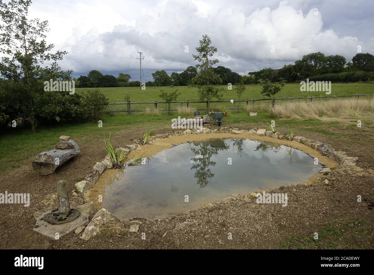 Garden pond construction using EPDM rubber pond liner, Cpotswolds, UK Stock Photo