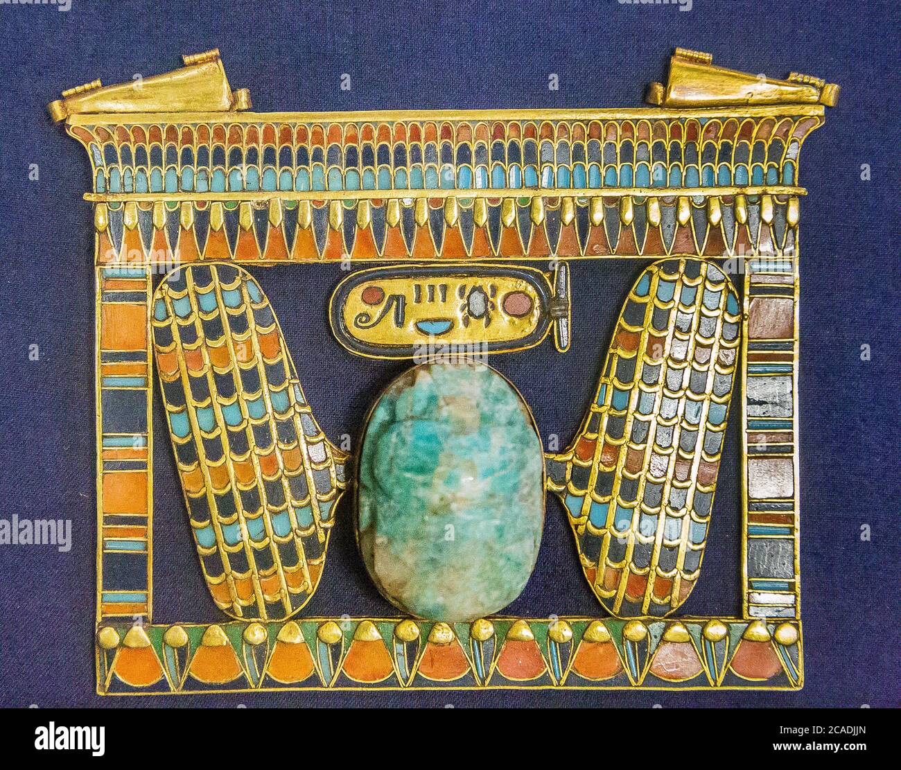 Cairo, Egyptian Museum, Tutankhamon jewellery : A pectoral in the shape of a pylon, with a cartouche of the king and a winged scarab. Stock Photo