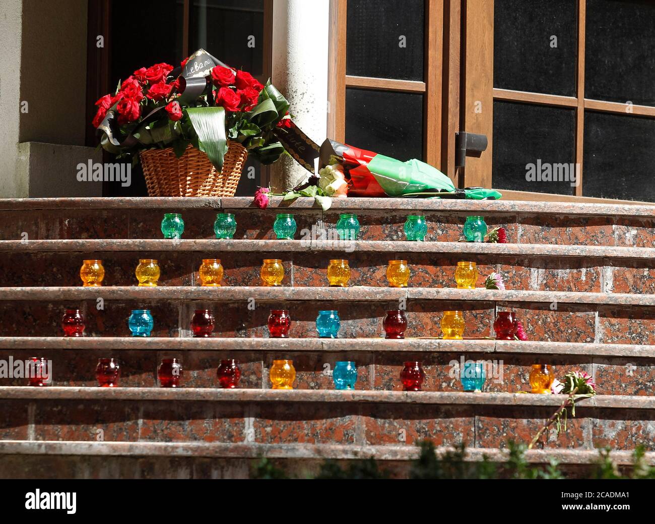 Kiev, Ukraine. 06th Aug, 2020. Flowers and candles in memory of the victims of the massive explosion in Beirut seen outside the Embassy of Lebanon in Kiev.The massive blast, allegedly by ammonium nitrate which was stored at the port exploded and killed at least 135 people and injured thousands in Beirut on August 04, 2020. Credit: SOPA Images Limited/Alamy Live News Stock Photo