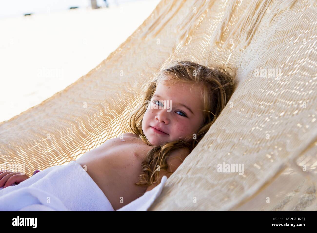 3 year old girl resting in hammock, Cabo San Lucas, Mexico Stock Photo