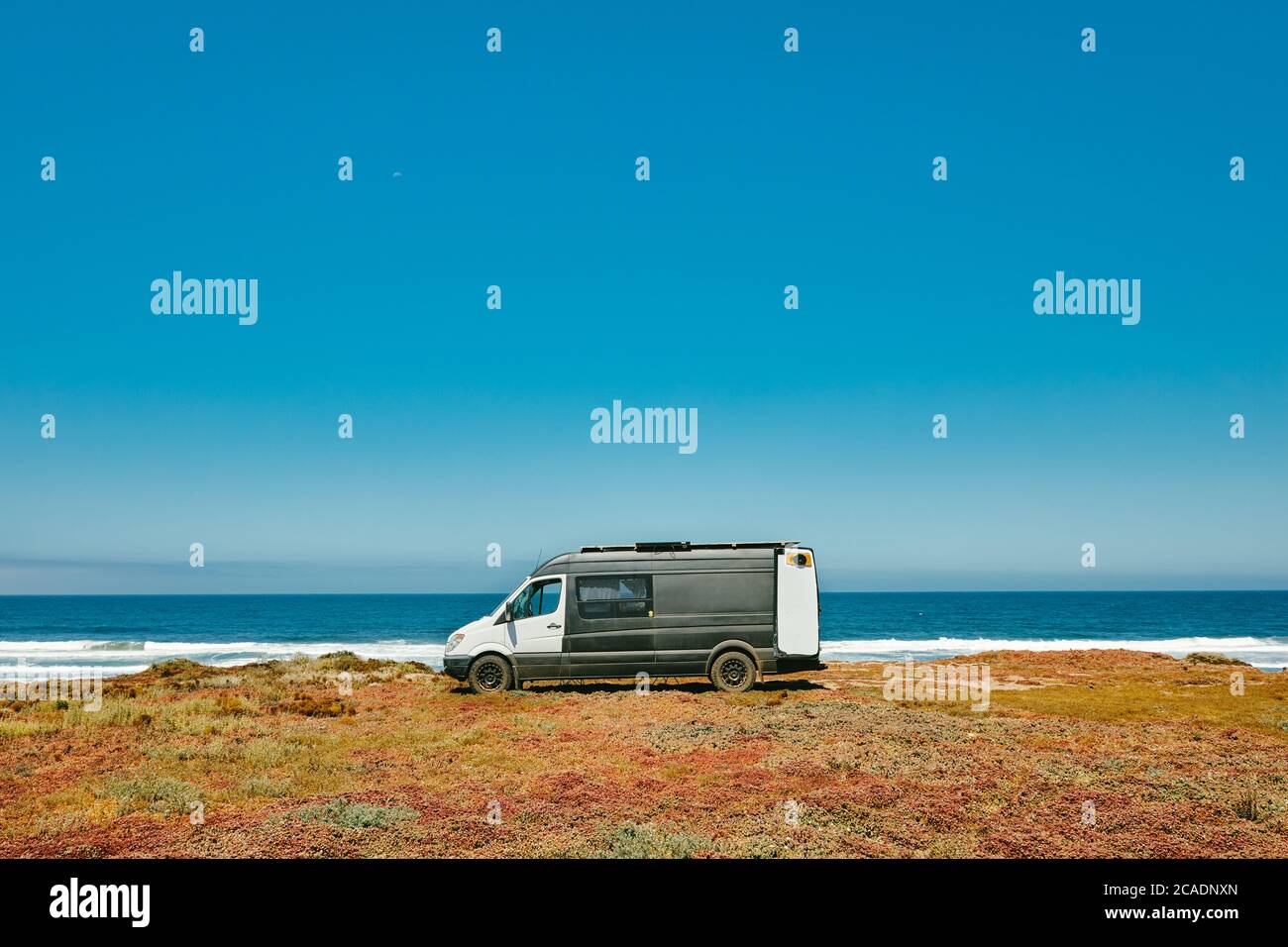 Camper van parked on ocean cliff beach during summer in Baja, Mexico ...