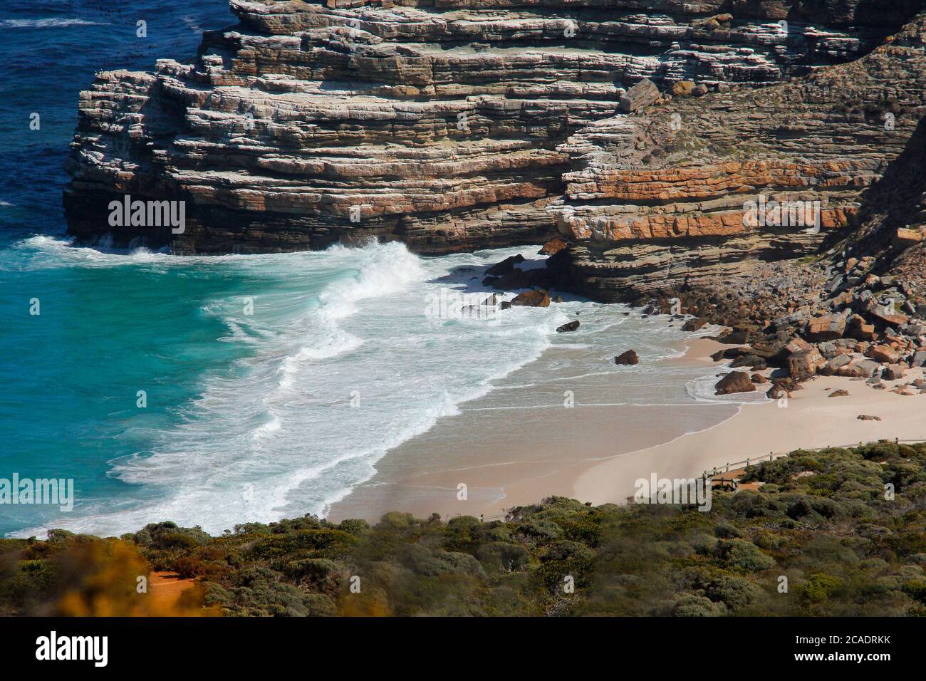 Disa Beach in the Cape Point National Park. The beach is accessed via a stairway from the parking area above. The rugged rocks are an iconic feature. Stock Photo