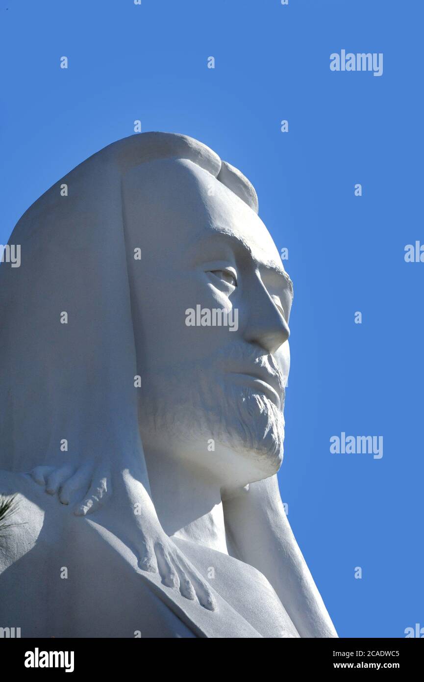 The face of Jesus seems to glow in the afternoon sun. Statue is Christ