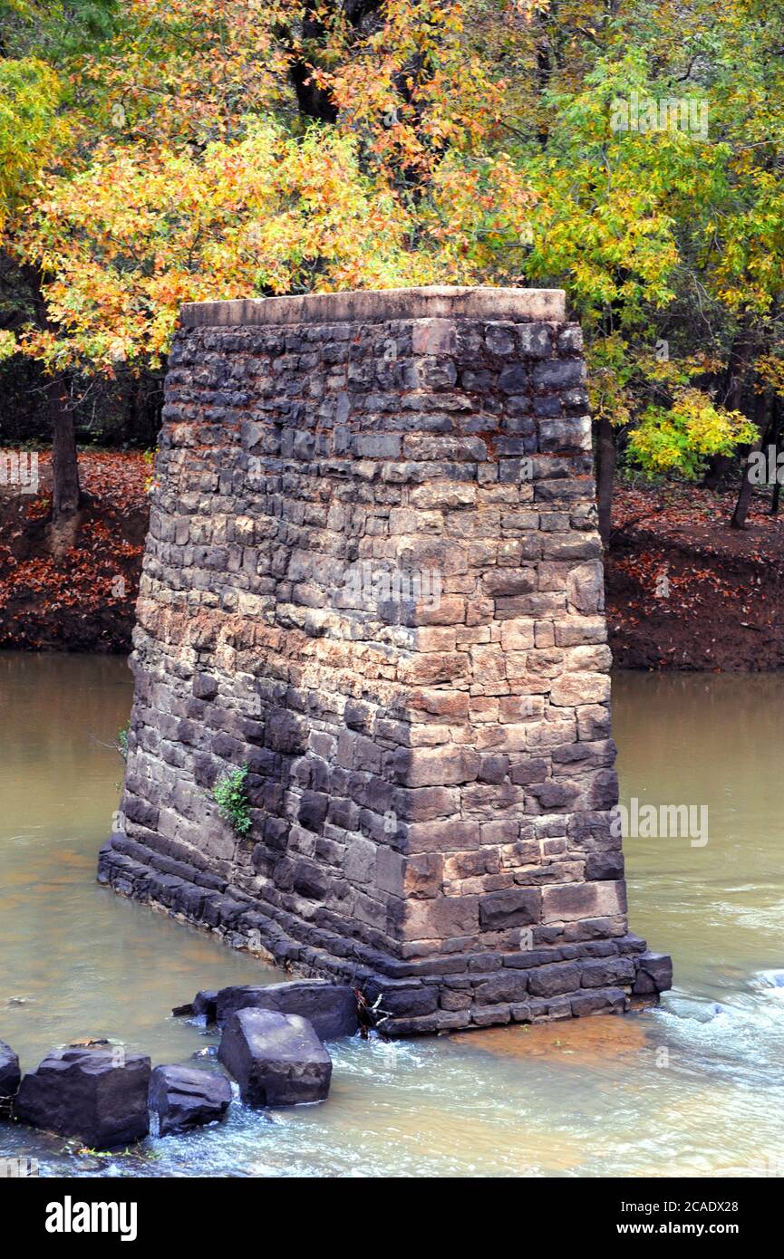 Solid, stone support refuses to give in to the Petit Jean River in