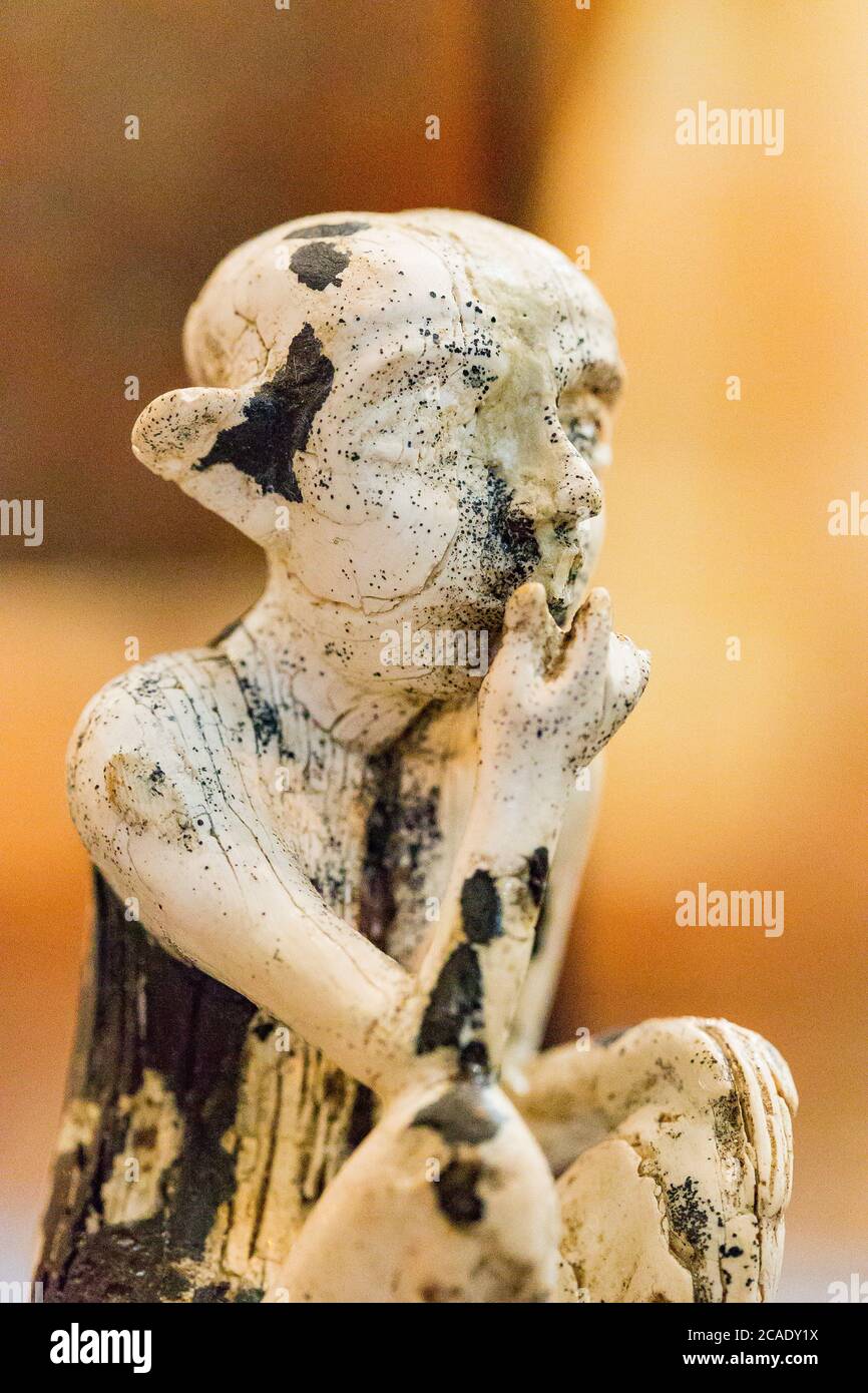 Egypt, Cairo, Egyptian Museum, statuettes coming from Tell el Farkha, early Dynastic period, in hippopotamus tusk. Sitting boy. Stock Photo