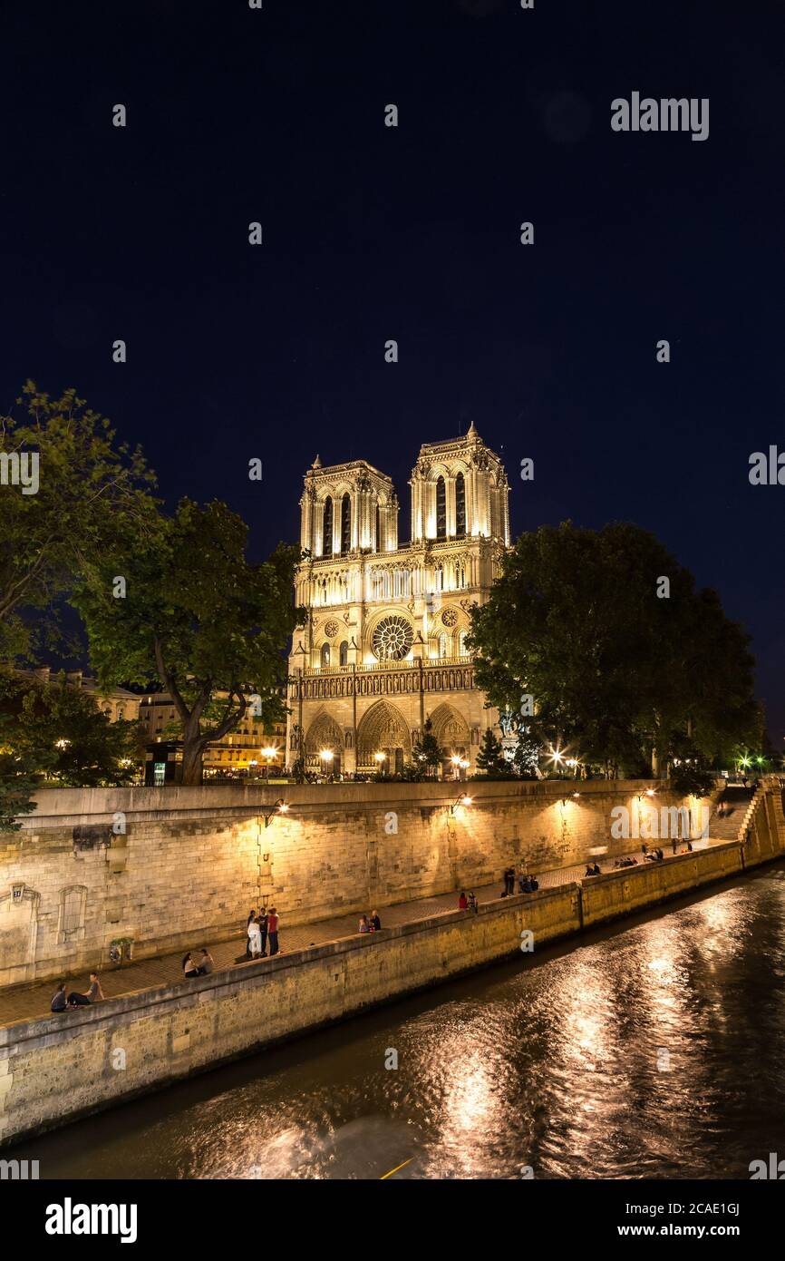 Notre Dame de Paris cathedral at night is one of the most visited places in Paris Stock Photo
