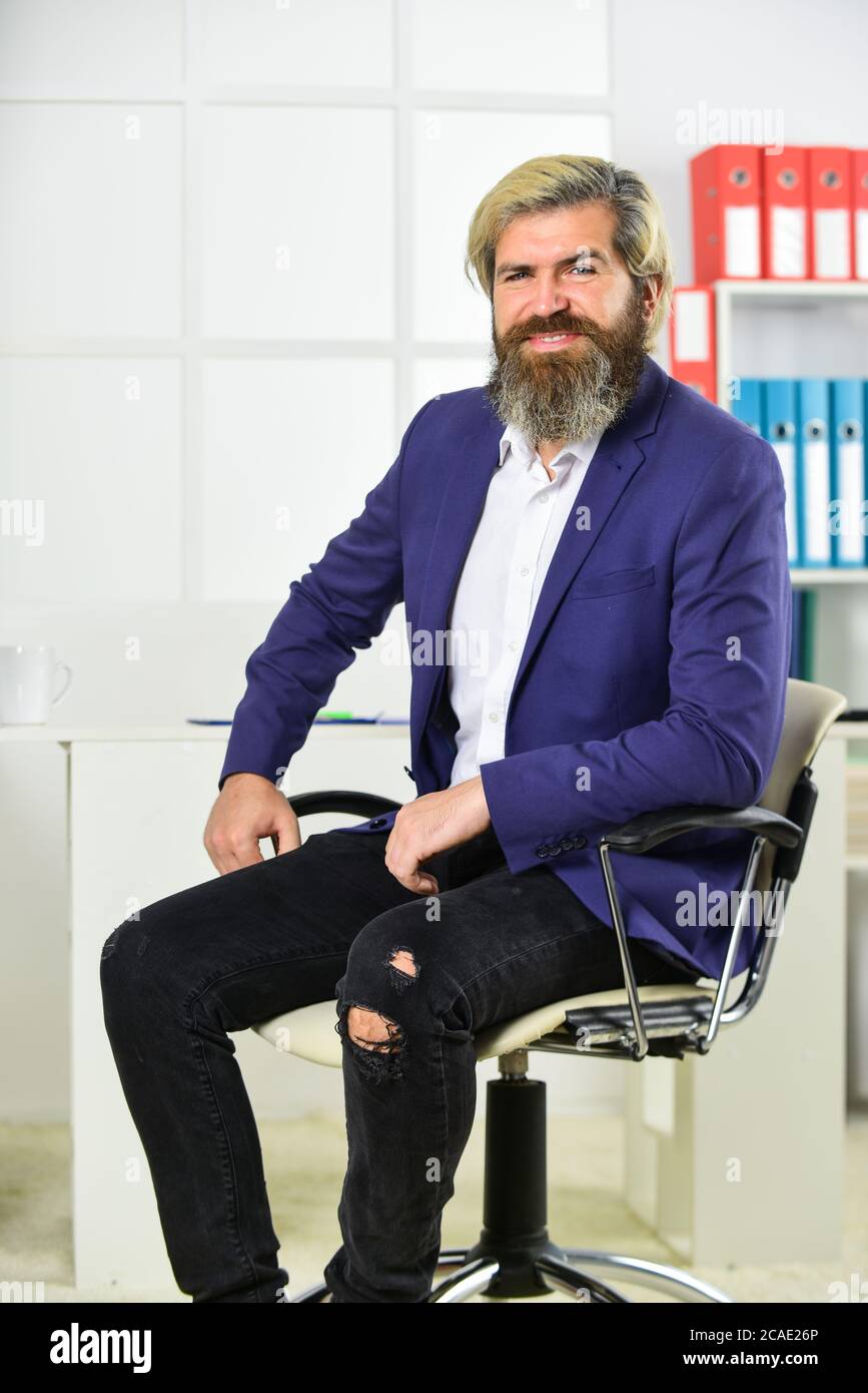 sense of composure. business man wearing smart casual clothes. handsome man  sit in office chair. Portrait of businessman standing in office.  professional businessman waiting for partner Stock Photo