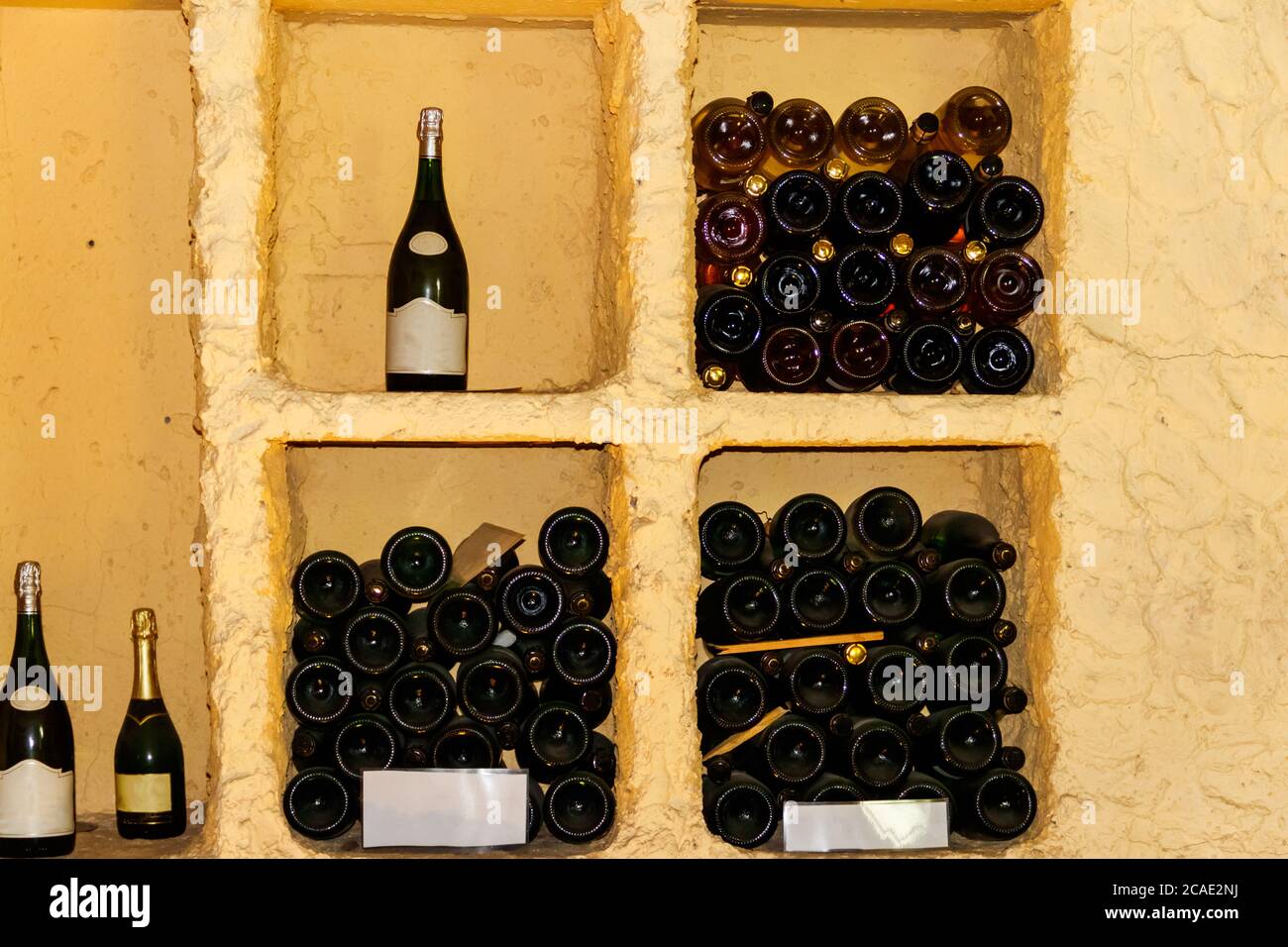 Champagne bottles in a wine cellar Stock Photo