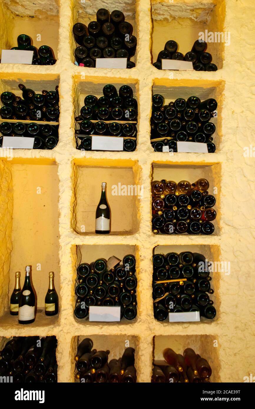 Champagne bottles in a wine cellar Stock Photo