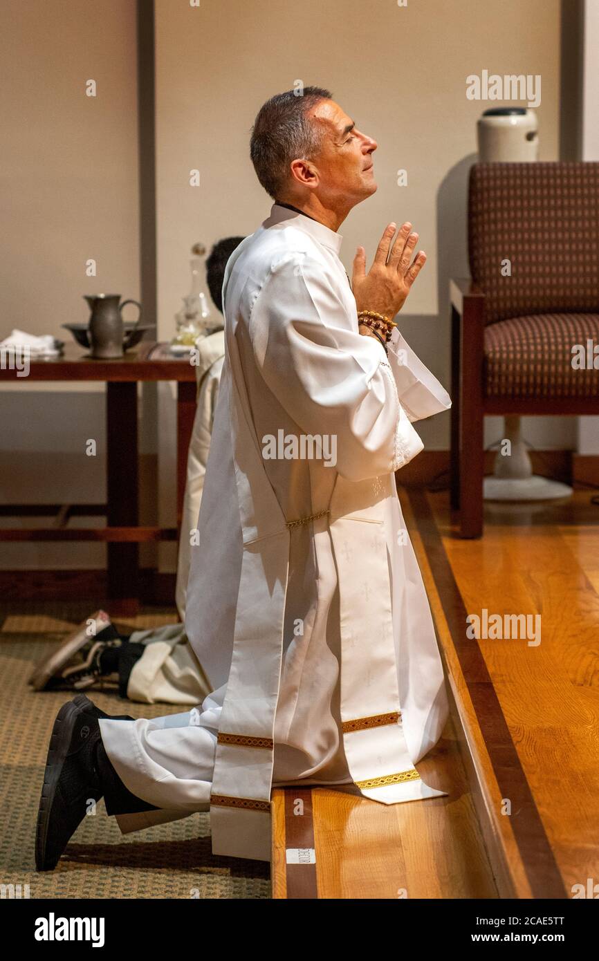 Man prays on his knees hi-res stock photography and images - Alamy