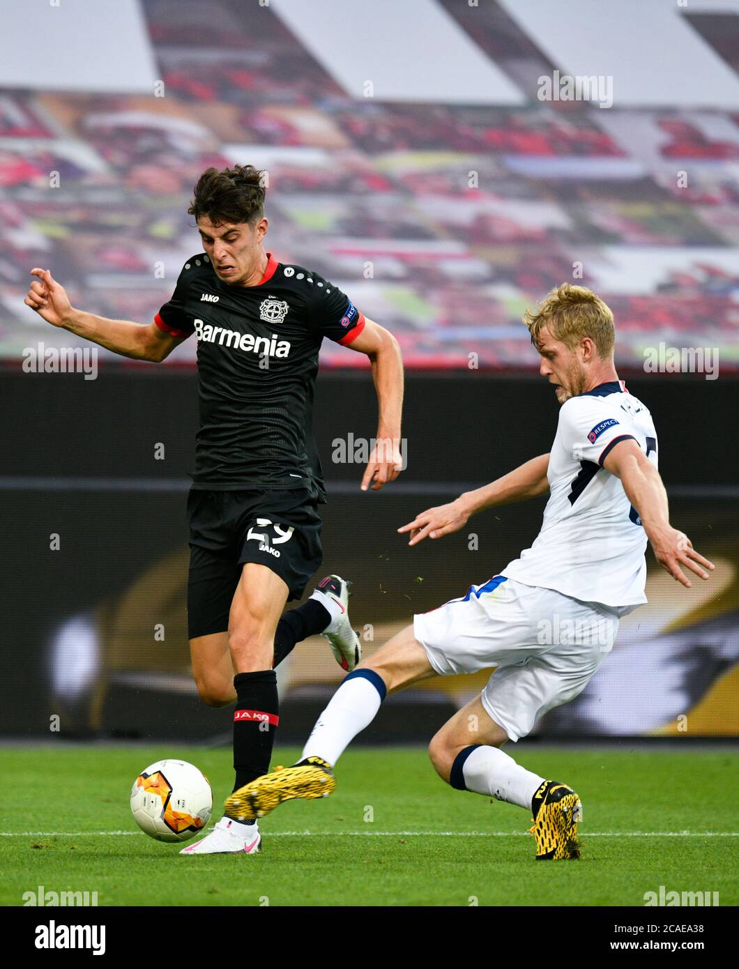 Leverkusen, Germany. 06th Aug, 2020. Football: Europa League, Bayer Leverkusen - Glasgow Rangers, knockout rounds, round of 16, second leg at the BayArena. Kai Havertz from Bayer 04 Leverkusen fights for the ball with Filip Helander (r) from Rangers. Credit: Sascha Schuermann/AFP-Pool/dpa/Alamy Live News Stock Photo
