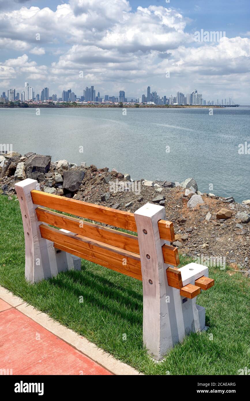 Public bench on a vantage point along the Mirador, looking across the bay to Panama City, Panama, Central America Stock Photo