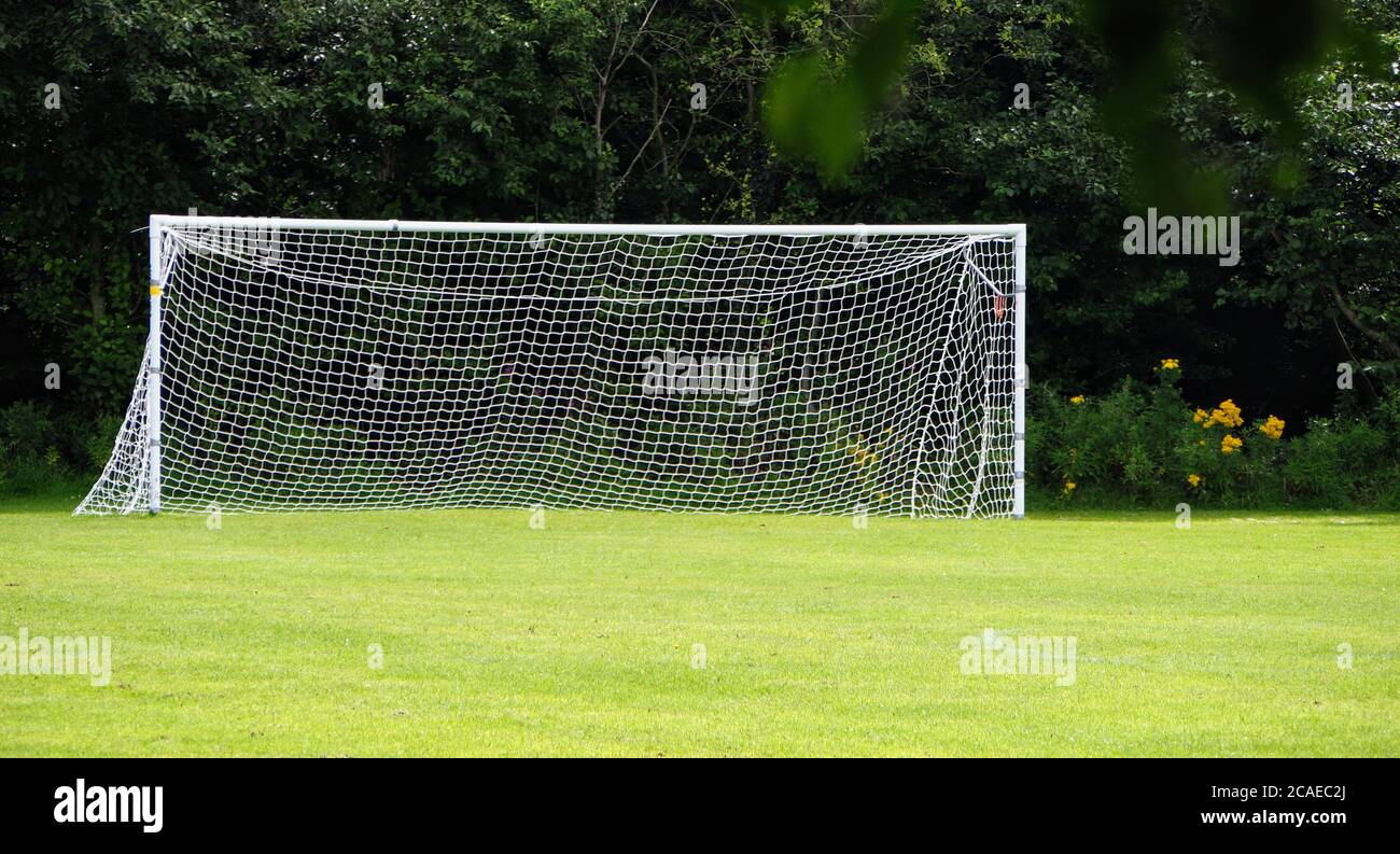 Empty net... goalposts on a playing field Stock Photo