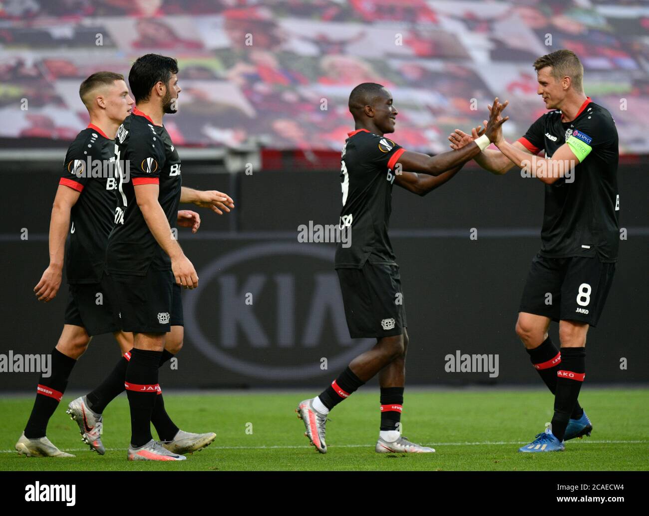 Bayer 04 leverkusens moussa diaby second right celebrates scoring hi