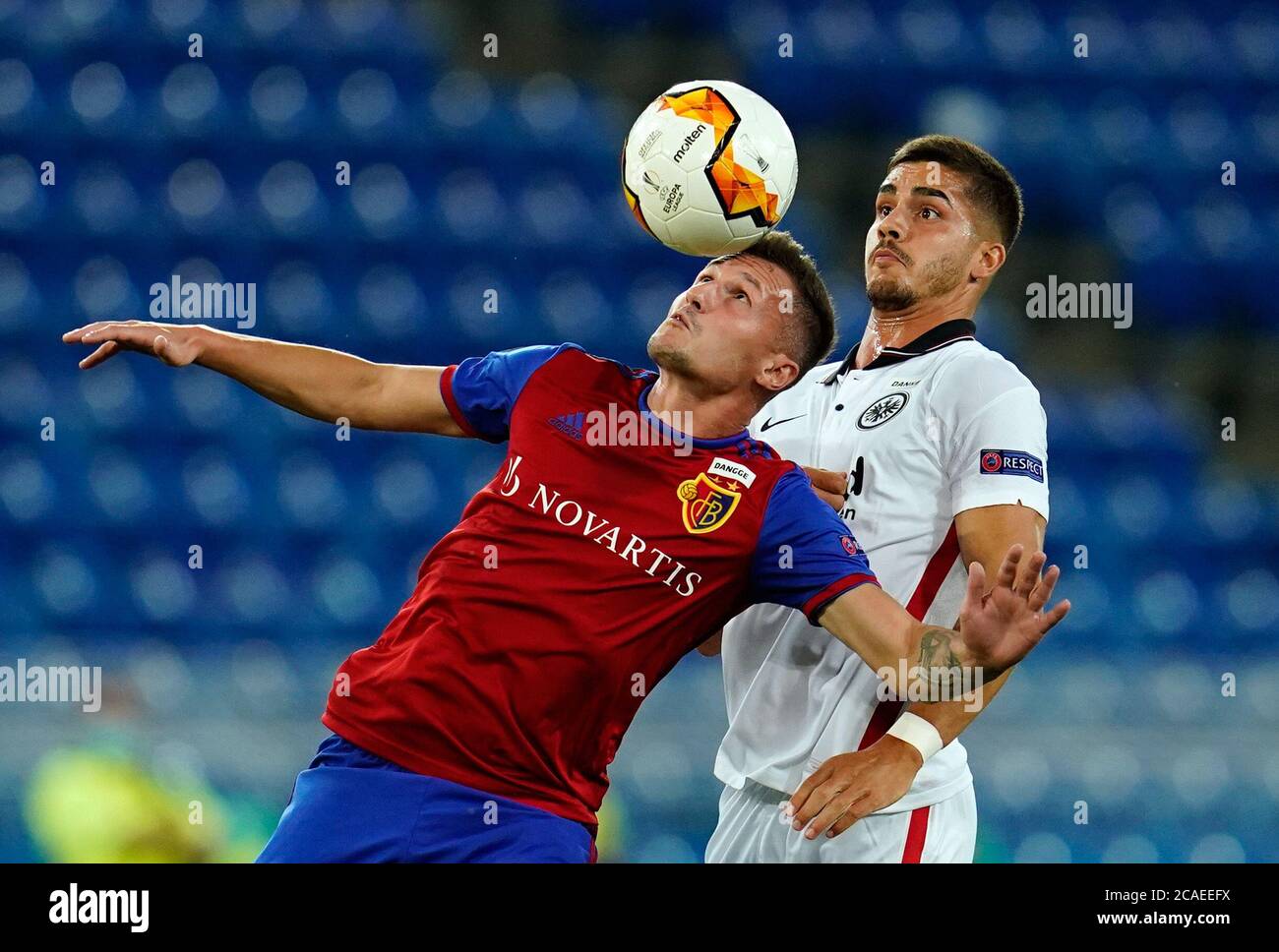 Basel, Switzerland. 06th Aug, 2020. Football: Europa League, FC Basel -  Eintracht Frankfurt, knockout round, round of 16, second leg at St.  Jakob-Park. Basel's Taulant Xhaka (l) and Frankfurt's Andre Silva fight