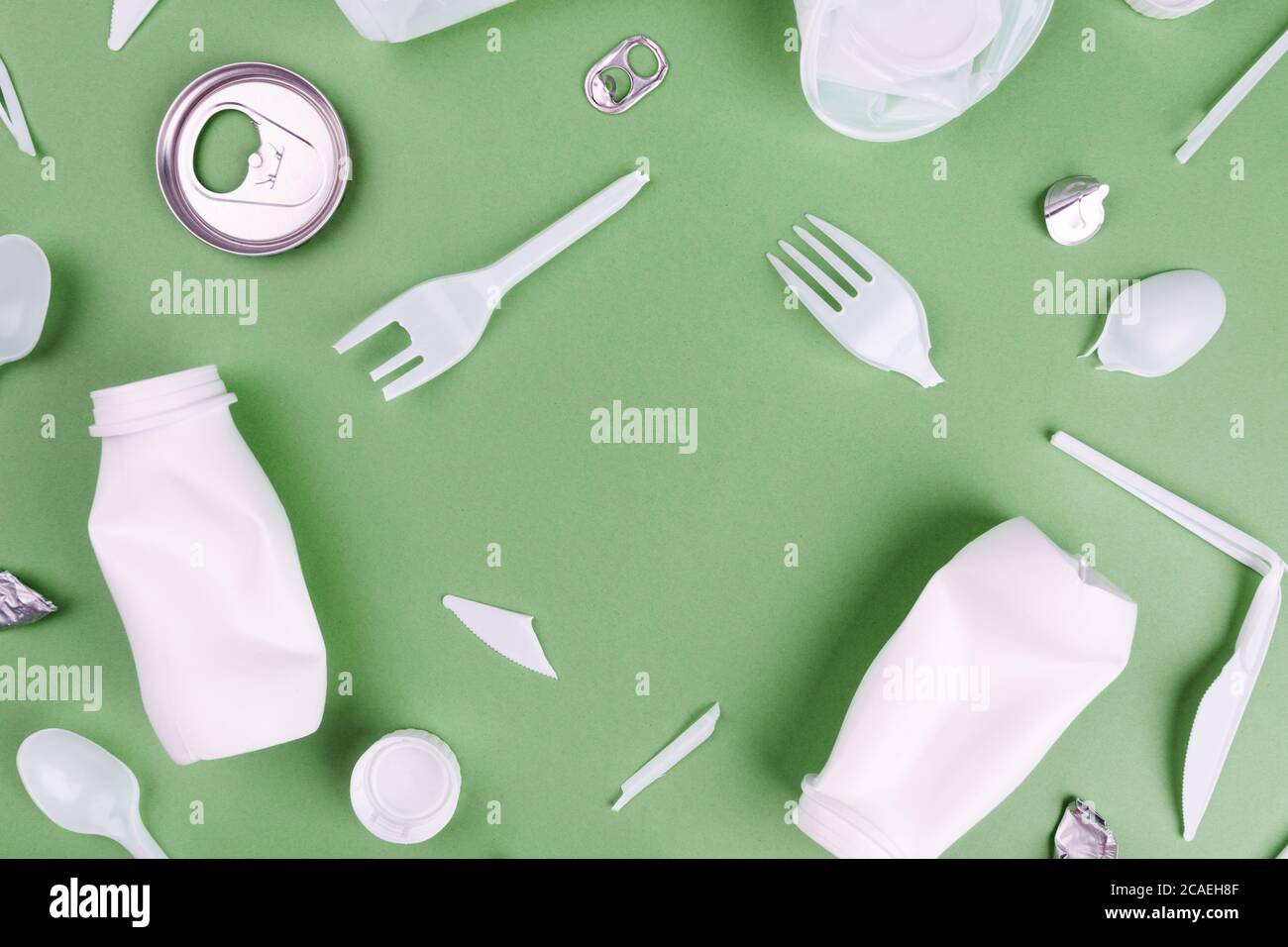 Eco plastic recycling concept. Single use plastics on green background Stock Photo Alamy