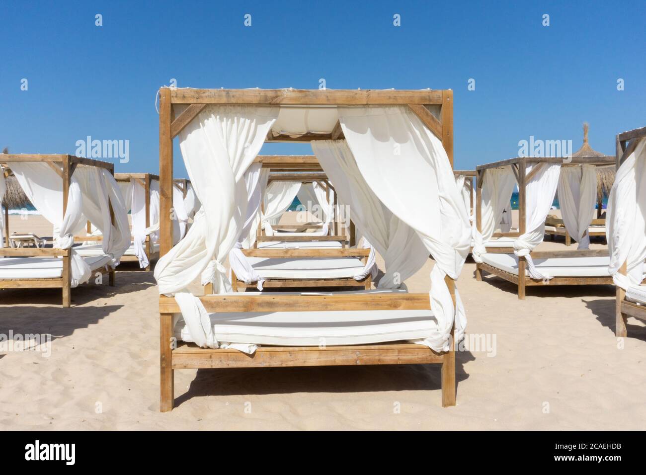 Rows of wooden canopies at the beach Stock Photo Alamy
