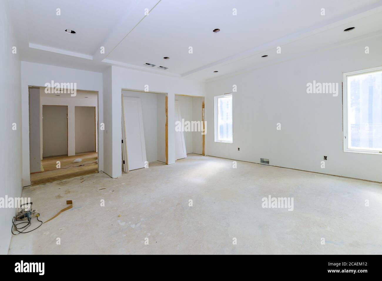 Construction building industry new home construction interior drywall tape a new home before installing Stock Photo