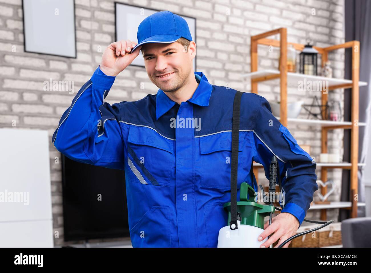 Pest Control Service Man At Home Smiling Stock Photo