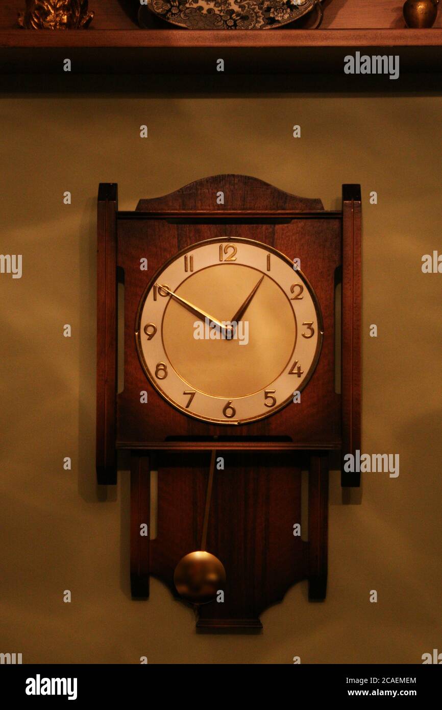 Classic wall clock pendulum hi-res stock photography and images - Alamy