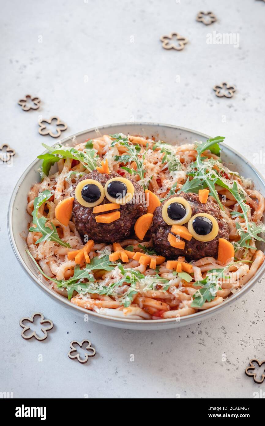Pasta spaghetti with funny birds meatballs for kids Stock Photo Alamy