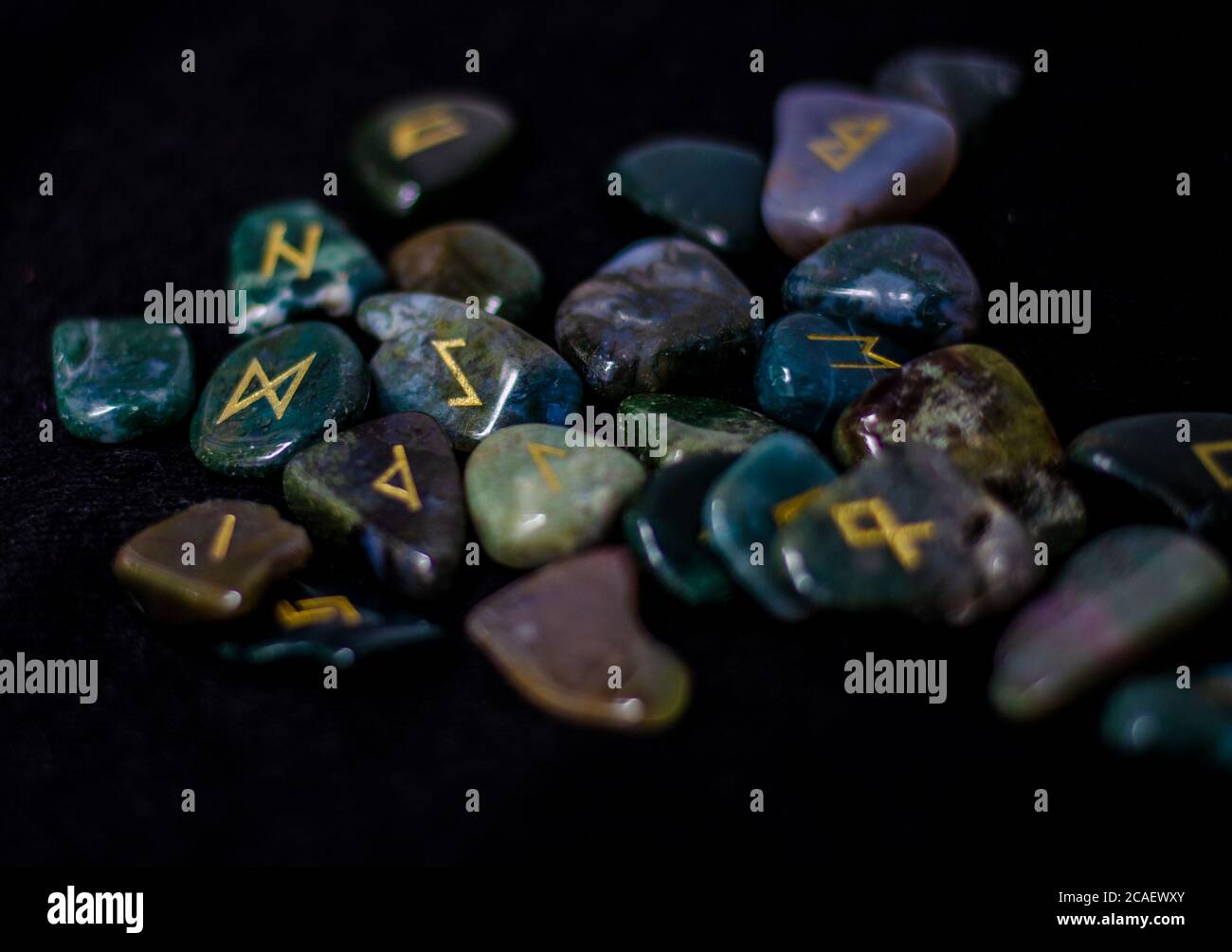 Secluded Runes Selective focus shot of a set of ancient runes to guess the future on a ...