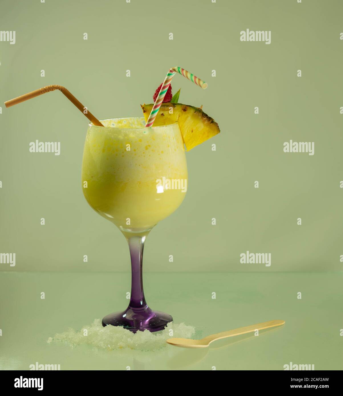 Traditional Caribbean pina colada cocktail with rum, coconut milk and