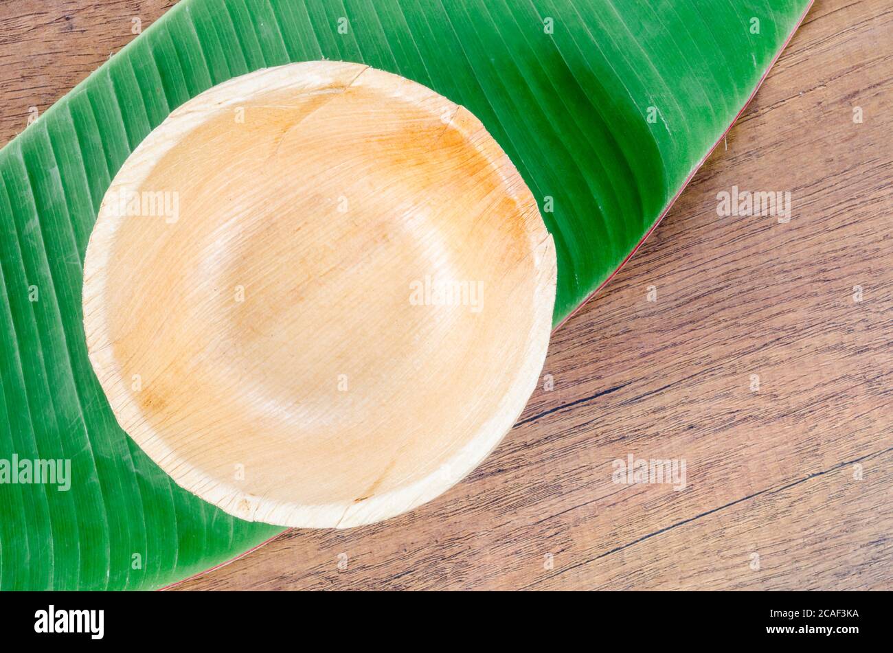 Cup from dried betel nut leaf palm, natural material. The Green product eco friendly concept. Stock Photo