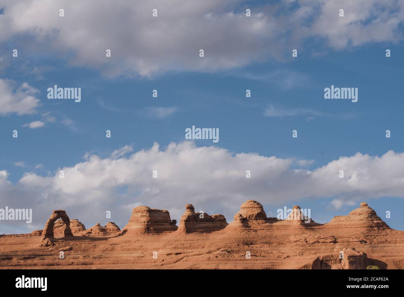 Delicate arch and clouds arches national park hi-res stock photography ...