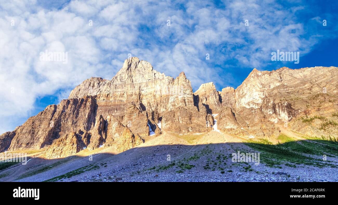 Morning sun light up the majestic Panorama Ridge and Mount Babel along the Consolation Lakes hiking trail in the Canadian Rockies of Banff National Pa Stock Photo