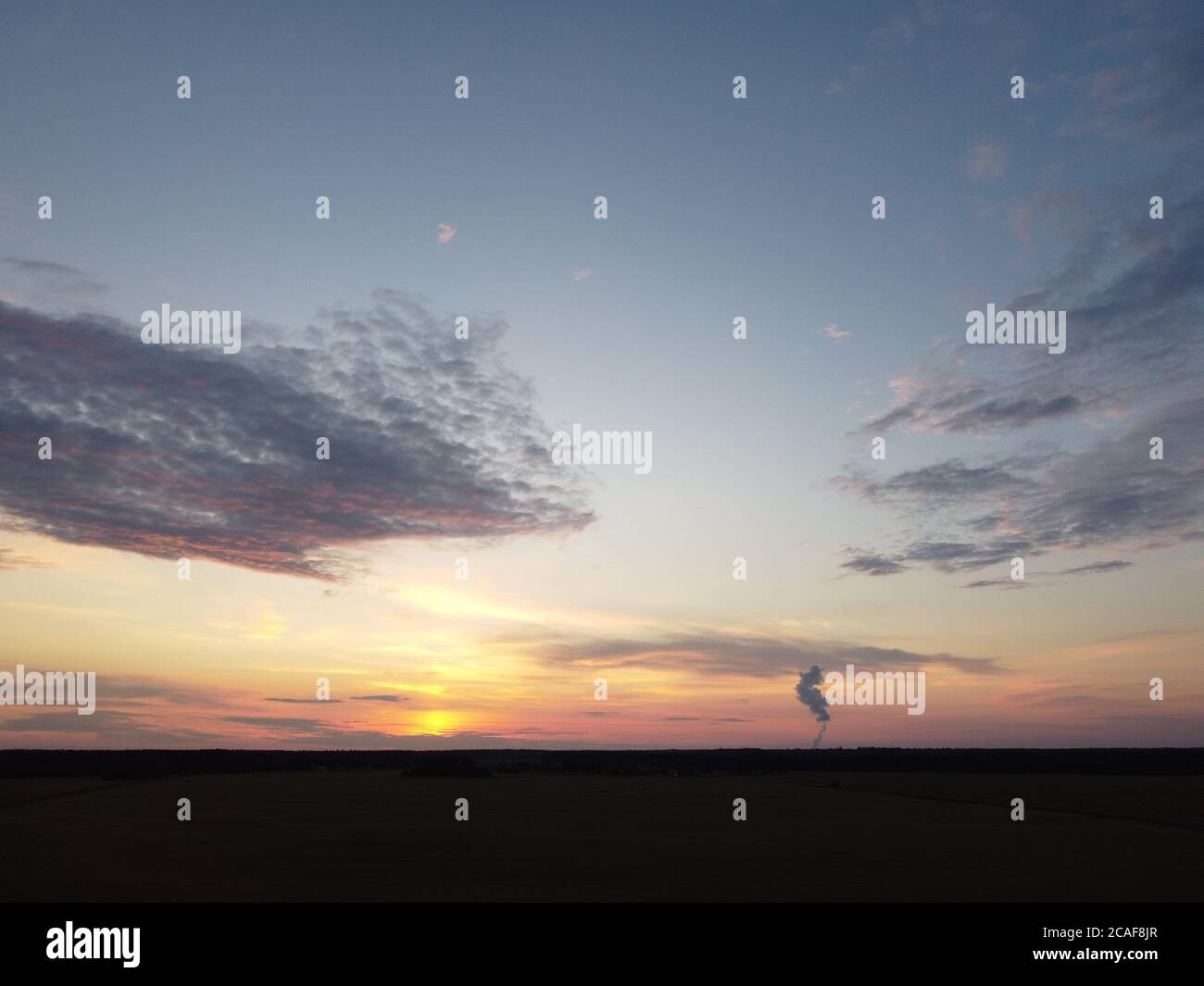 sunset sky with clouds background Stock Photo - Alamy