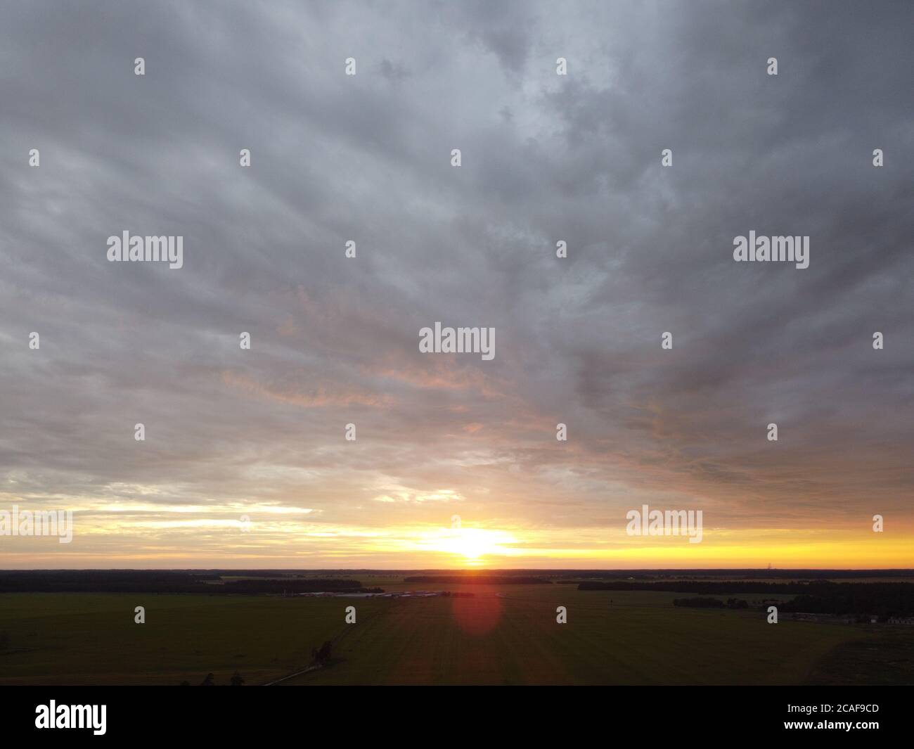 sunset sky with clouds background Stock Photo - Alamy