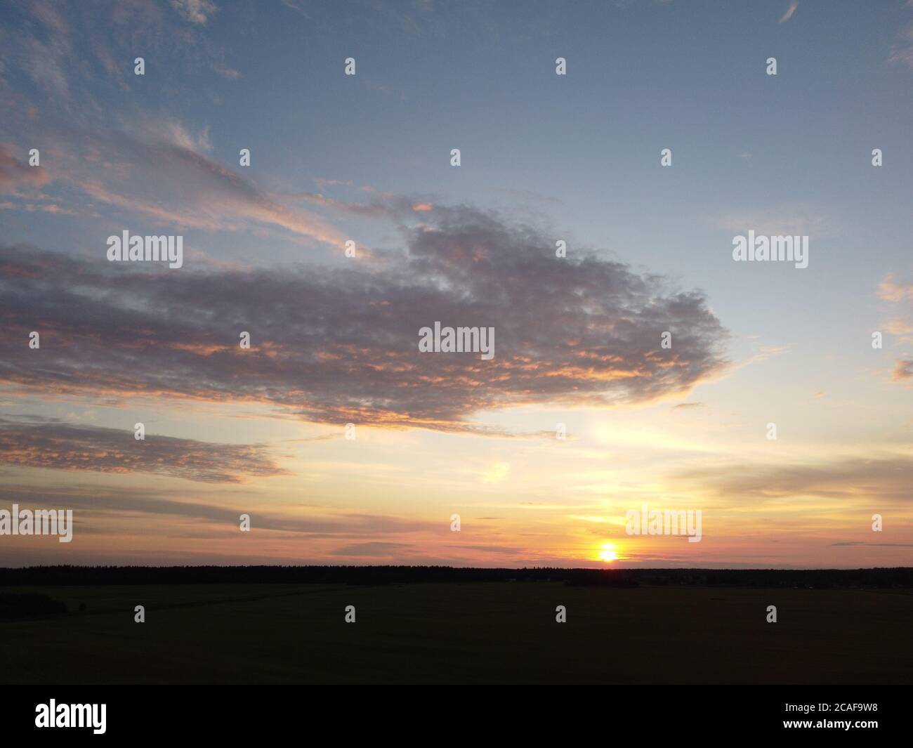 sunset sky with clouds background Stock Photo - Alamy