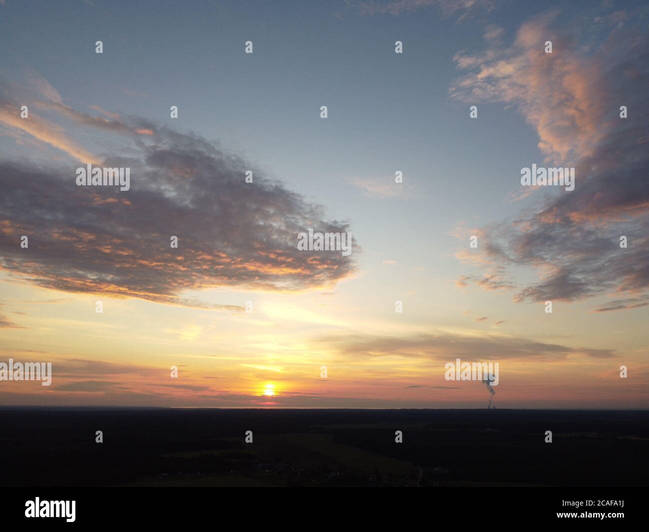 sunset sky with clouds background Stock Photo - Alamy