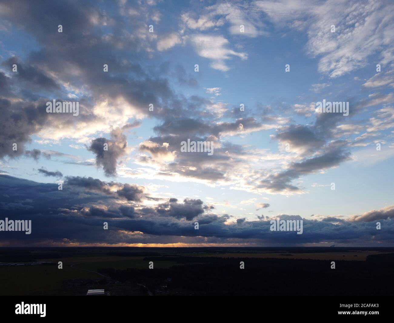 sunset sky with clouds background Stock Photo - Alamy
