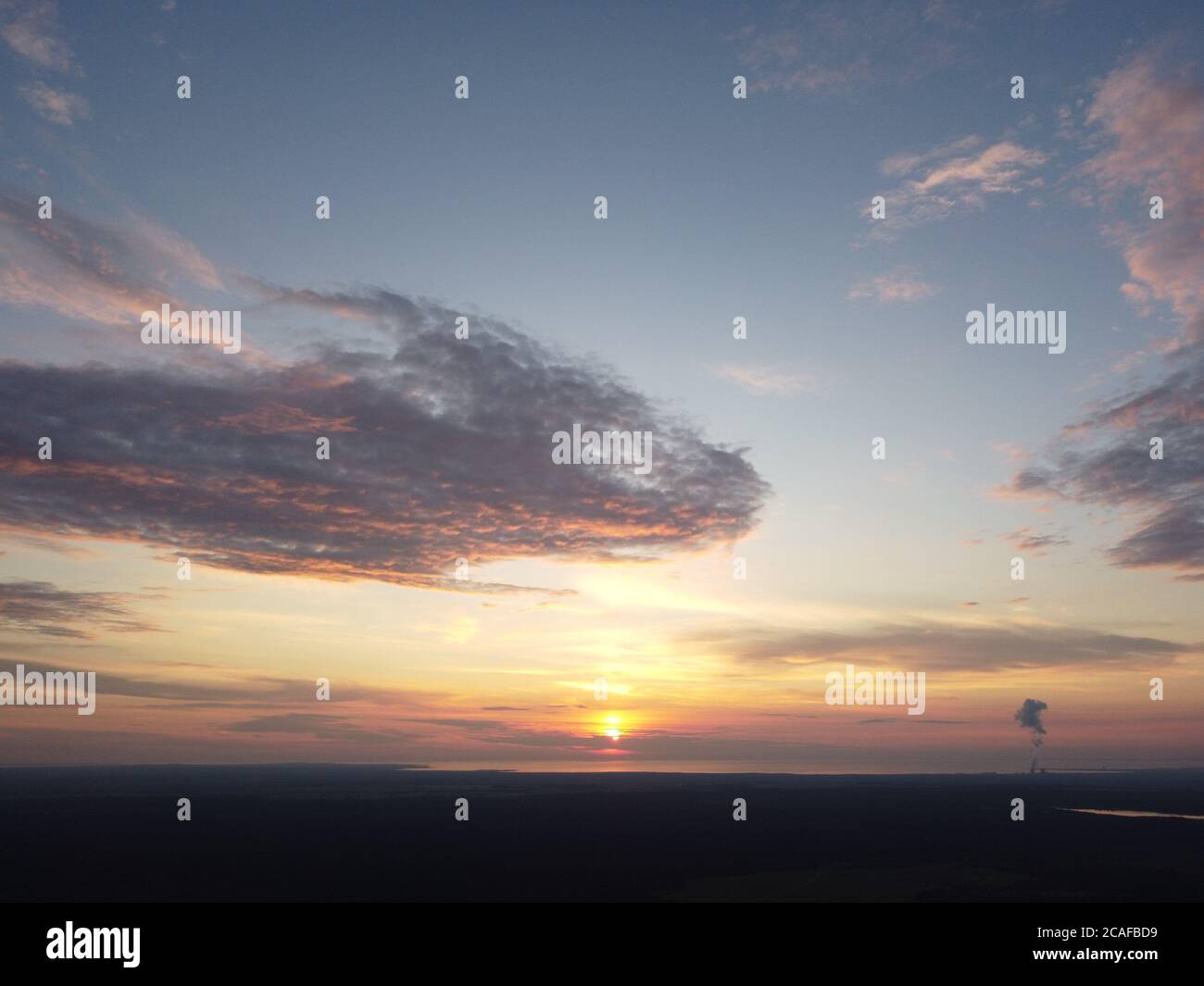 sunset sky with clouds background Stock Photo - Alamy