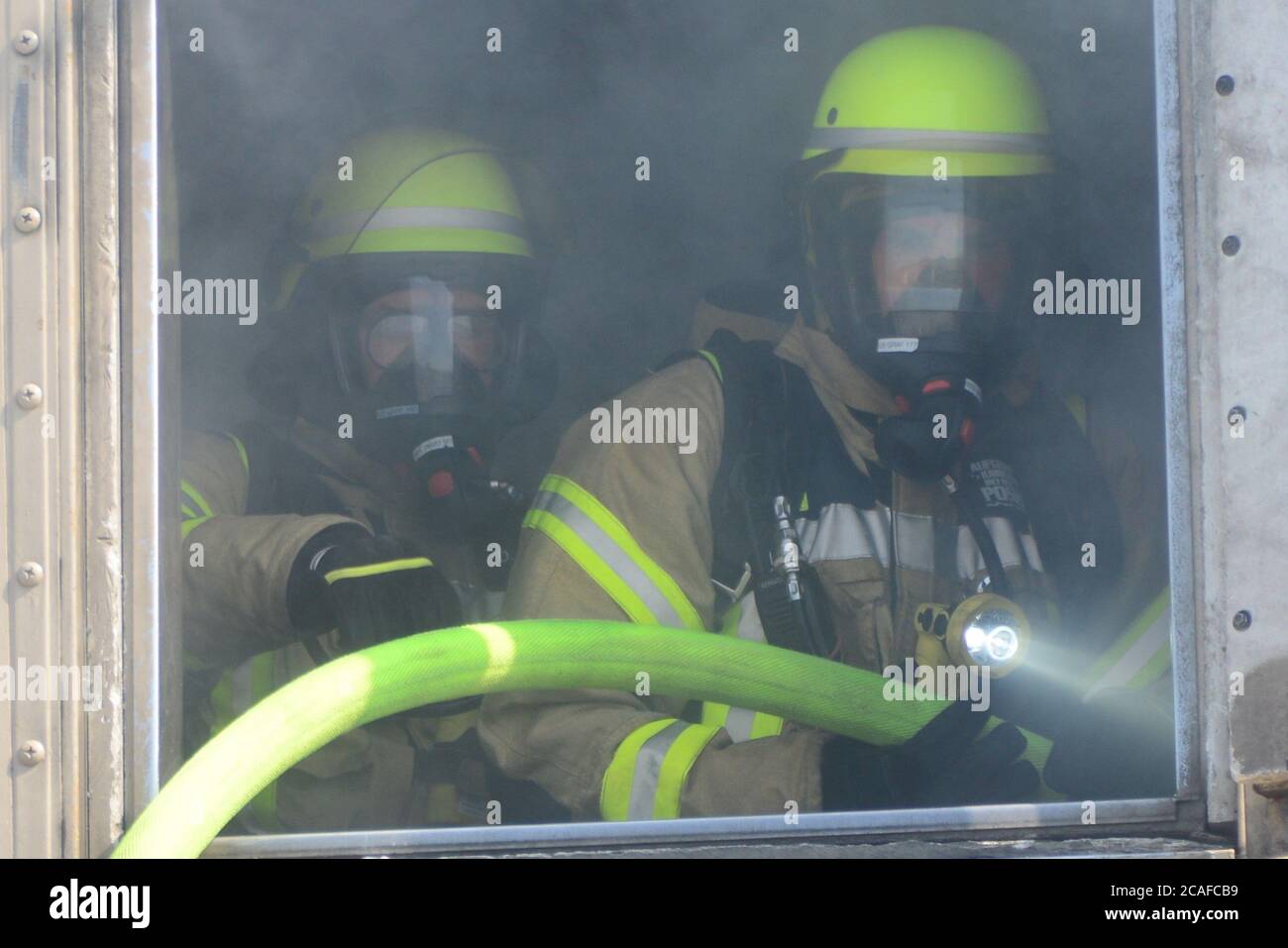 U.S. Army civilian firefighters from Stuttgart, Hohenfels, Kaierslautern and Grafenwoehr military installations, complete their annual firefighter certification training at the U.S. Army Fire Fighting Training Center in Ansbach, Germany, Aug. 6, 2020. (U.S. Army photo by Charles Rosemond) Stock Photo