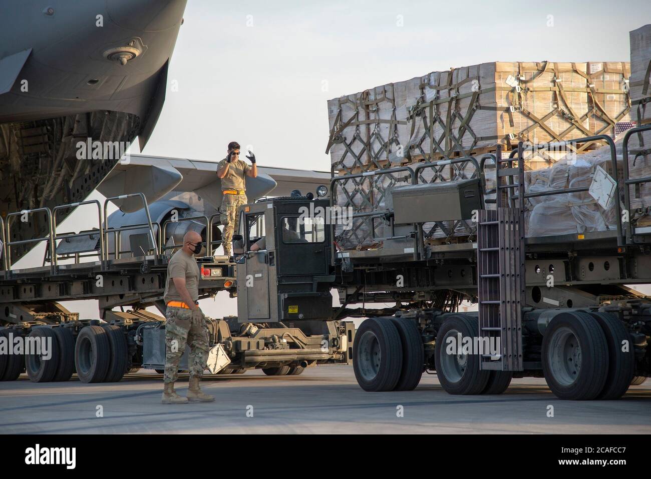 U.S. Air Force Airmen load humanitarian aid supplies a U.S. Air Force C-17 Globemaster III at Al Udeid Air Base, Qatar, Aug. 6, 2020, bound for Beirut, Lebanon. U.S. Central Command is coordinating with the Lebanese Armed Forces and U.S. Embassy-Beirut to transport critical supplies as quickly as possible to support the needs of the Lebanese people. (U.S. Air Force photo by Staff Sgt. Heather Fejerang) Stock Photo