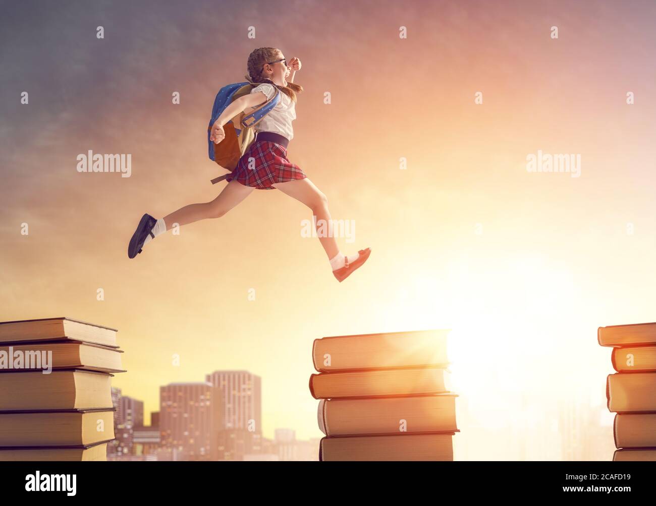 Back To School Happy Cute Industrious Child Running And Jumping On Books On Background Of Sunset Urban Landscape Concept Of Education And Reading T Stock Photo Alamy Back To School Happy Cute Industrious Child Running And Jumping On Books On Background Of Sunset Urban Landscape Concept Of Education And Reading T Stock Photo Alamy